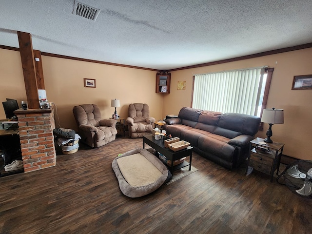 living room featuring ornamental molding, dark hardwood / wood-style floors, and a textured ceiling