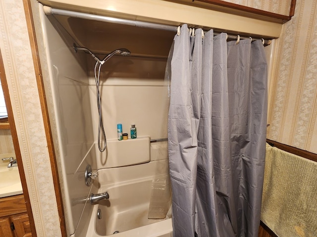 bathroom with shower / bath combo with shower curtain