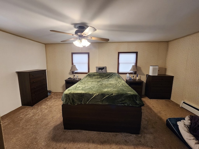 carpeted bedroom featuring ceiling fan and baseboard heating