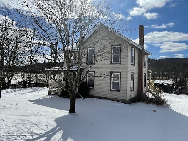 view of snow covered property