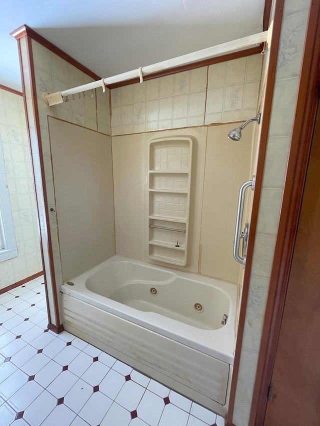 bathroom with shower / tub combination, ornamental molding, and built in features