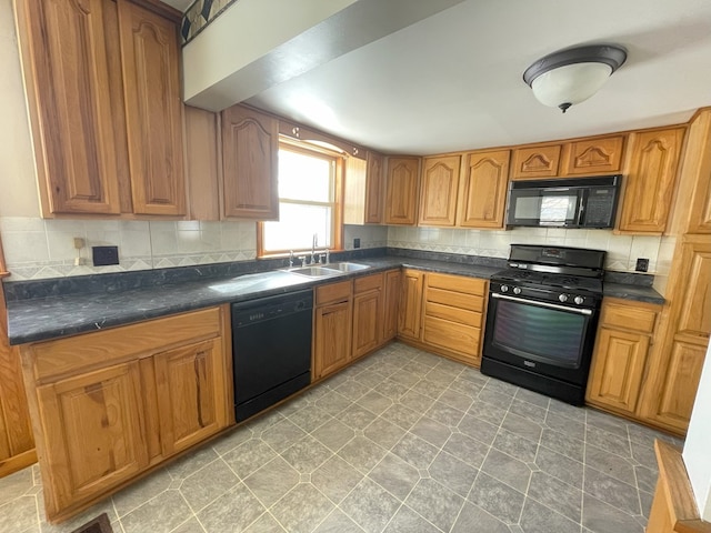 kitchen featuring tasteful backsplash, sink, and black appliances