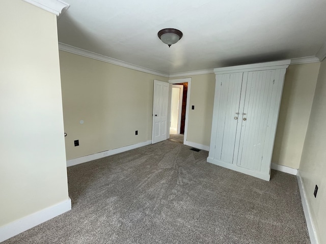 unfurnished bedroom with carpet floors and ornamental molding