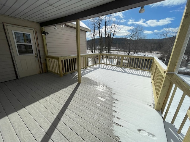 view of snow covered deck