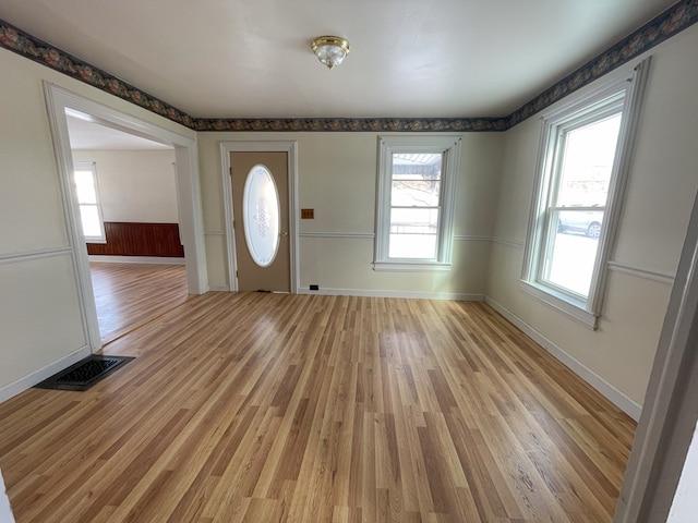 entryway with light hardwood / wood-style floors