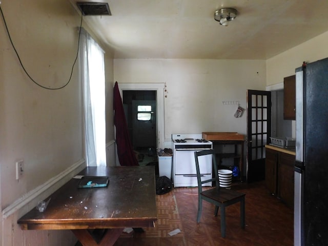 interior space featuring dark parquet flooring