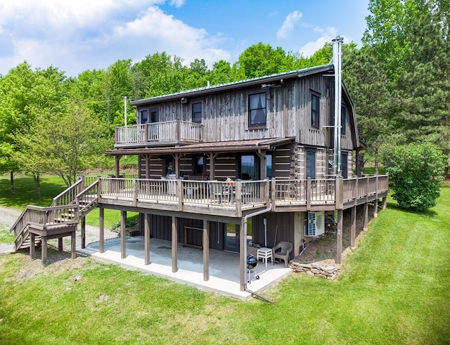 436 Teeter Rd, Genesee, PA 16923 - back of property featuring a patio area, a deck, a lawn, and stairs