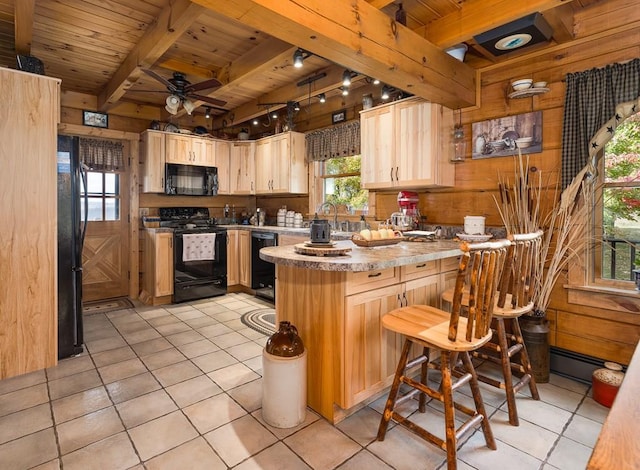 436 Teeter Rd, Genesee, PA 16923 - kitchen with black appliances, a wood ceiling with exposed beams, a peninsula, light tile patterned floors, and wood walls