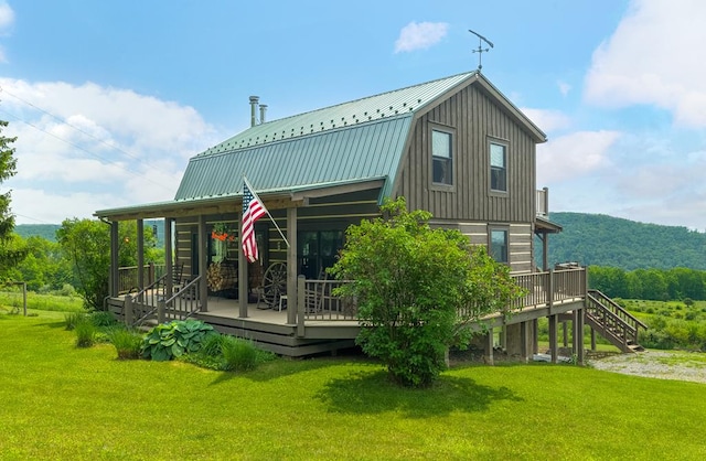 436 Teeter Rd, Genesee, PA 16923 - back of property featuring a yard, a metal roof, and a wooden deck