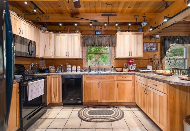 436 Teeter Rd, Genesee, PA 16923 - kitchen with black appliances, a peninsula, plenty of natural light, a wooden ceiling with exposed beams, and light tile patterned floors