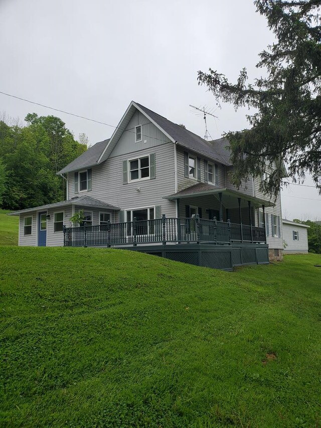 1750 Bailey Creek Rd, Millerton, PA 16936 - rear view of house with a lawn and a wooden deck