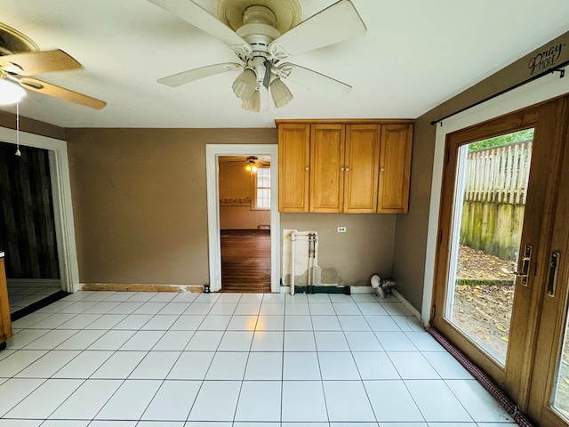 washroom featuring ceiling fan and light tile patterned floors