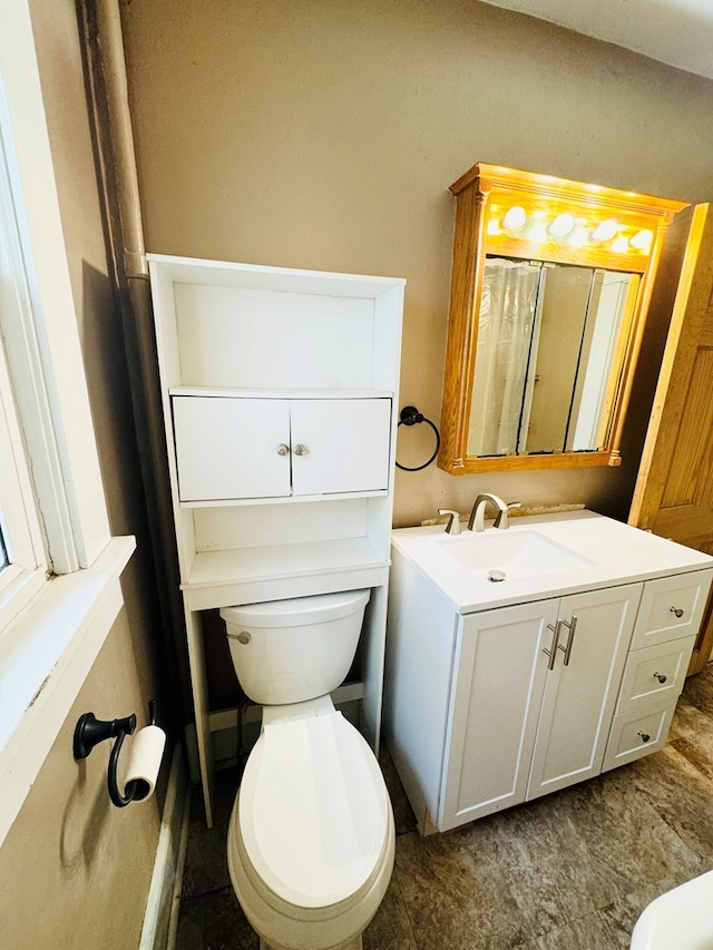 bathroom with vanity and toilet