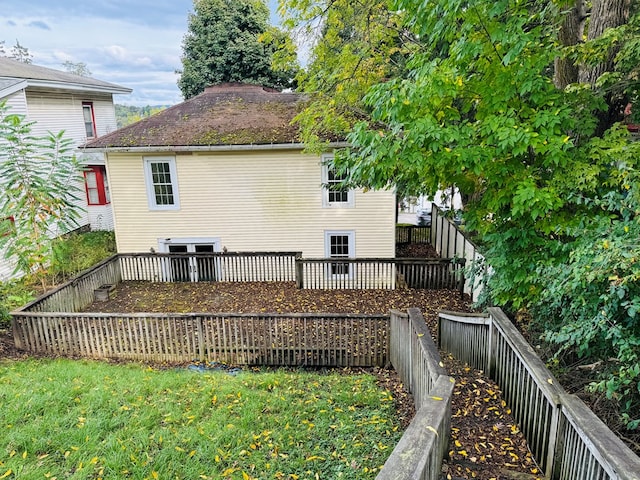 view of property exterior with a deck