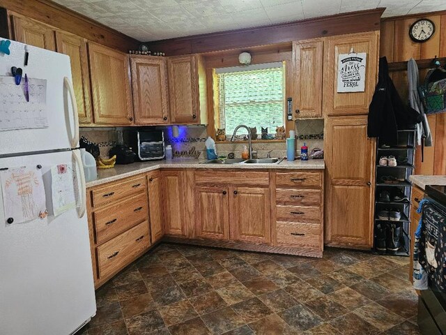 516 Dutch Hill Rd, Coudersport, PA 16915 - kitchen with a sink, freestanding refrigerator, light countertops, and stone finish floors