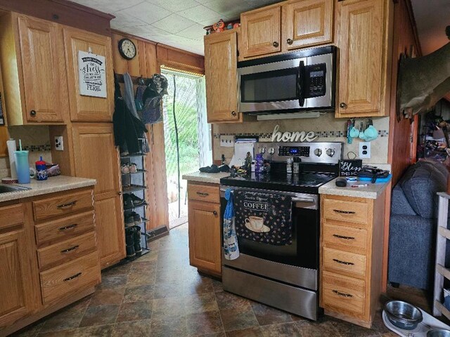 516 Dutch Hill Rd, Coudersport, PA 16915 - kitchen featuring appliances with stainless steel finishes, light countertops, and stone finish flooring