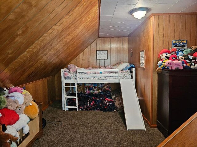 516 Dutch Hill Rd, Coudersport, PA 16915 - bedroom with wooden walls, vaulted ceiling, and carpet