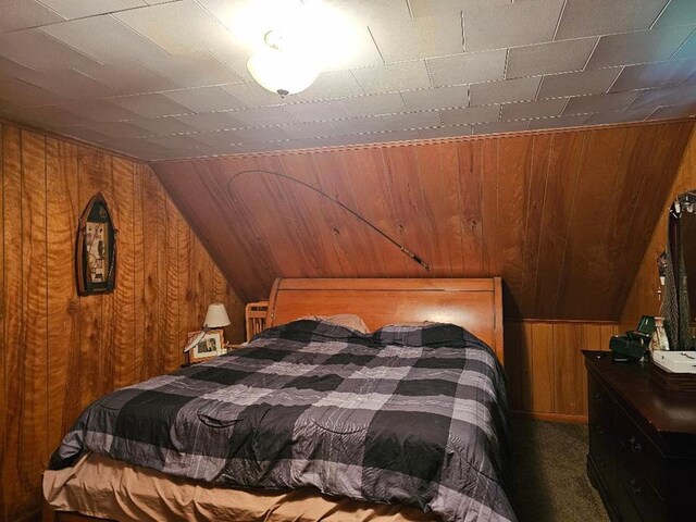 516 Dutch Hill Rd, Coudersport, PA 16915 - bedroom with wooden walls, vaulted ceiling, and carpet floors