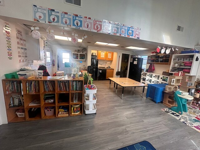 interior space featuring visible vents and wood finished floors