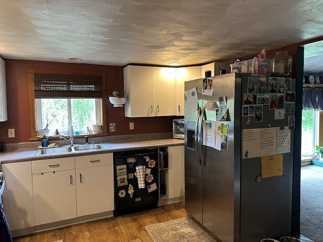 146 Academy St, Genesee, PA 16923 - kitchen with stainless steel refrigerator with ice dispenser, black dishwasher, a sink, and healthy amount of natural light