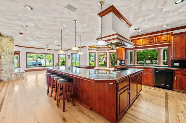 kitchen with a large island, sink, dishwasher, hanging light fixtures, and ornamental molding