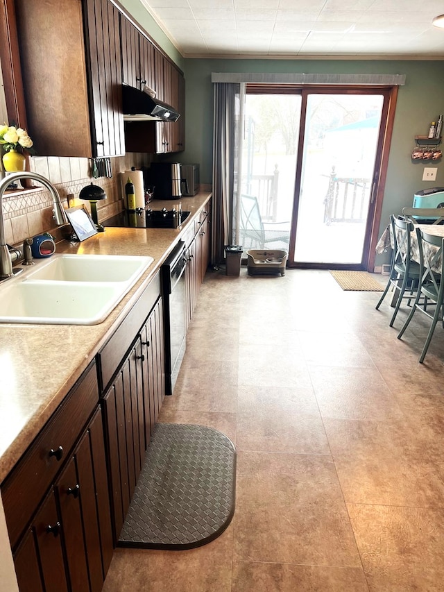 kitchen featuring sink, black appliances, crown molding, and dark brown cabinetry