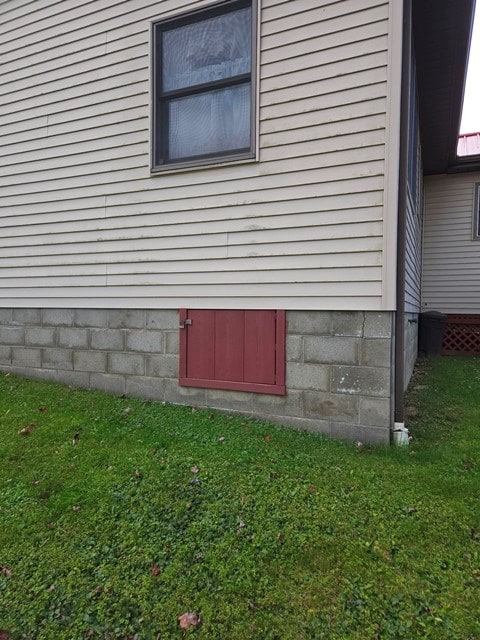 view of home's exterior featuring a yard