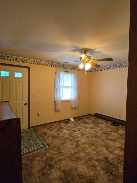 entryway featuring carpet flooring, baseboard heating, and ceiling fan