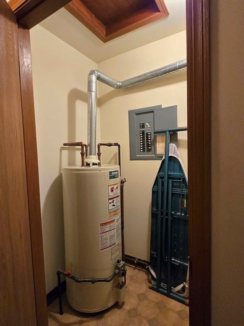 utilities featuring electric panel and gas water heater