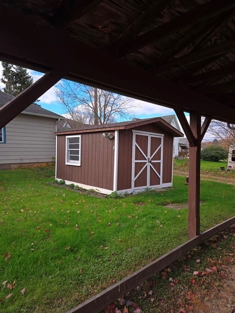 view of outdoor structure with a lawn