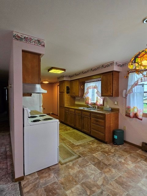 kitchen featuring electric stove and sink