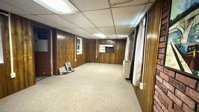 128 Bradford St, Sayre, PA 18840 - basement with carpet flooring, a paneled ceiling, and wooden walls