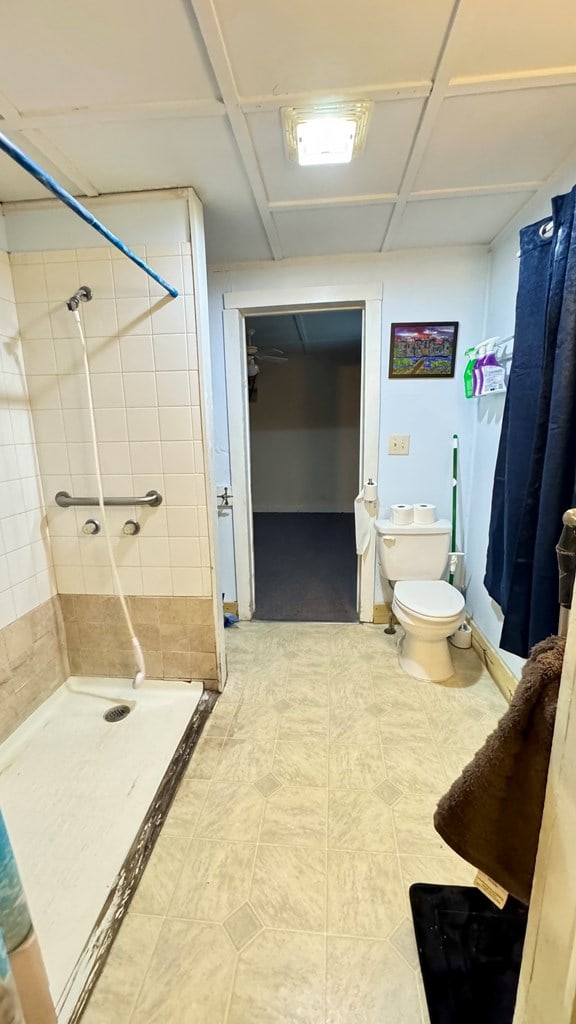 128 Bradford St, Sayre, PA 18840 - bathroom with a shower stall and toilet