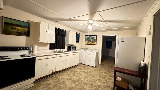128 Bradford St, Sayre, PA 18840 - kitchen featuring range with electric cooktop, independent washer and dryer, a sink, a ceiling fan, and stainless steel microwave