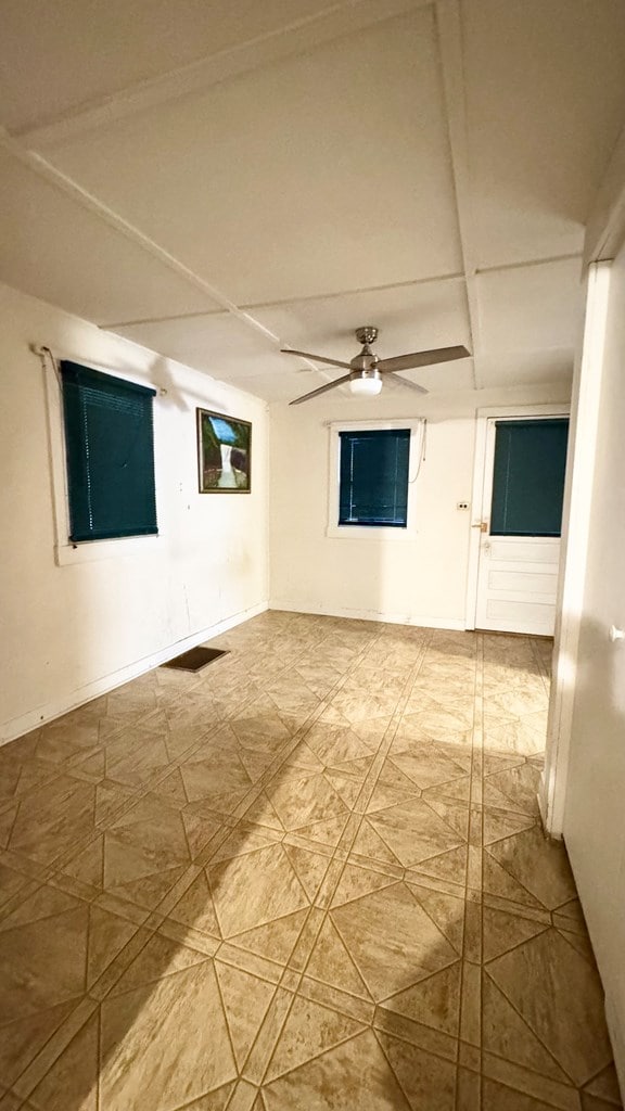 128 Bradford St, Sayre, PA 18840 - unfurnished room with ceiling fan