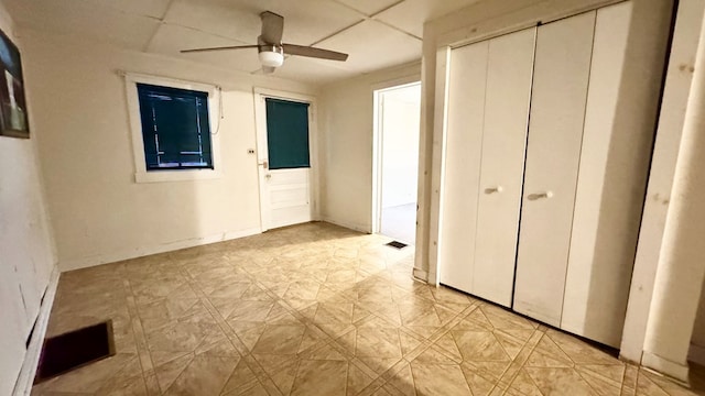128 Bradford St, Sayre, PA 18840 - unfurnished bedroom with a closet, a ceiling fan, and light floors