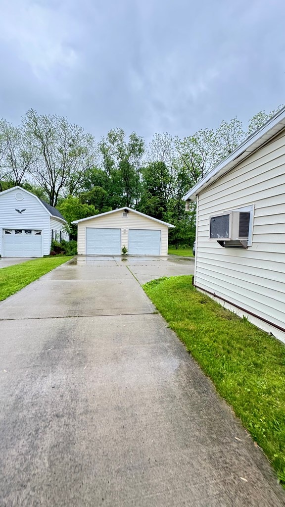 128 Bradford St, Sayre, PA 18840 - view of yard with an outbuilding, cooling unit, and a detached garage