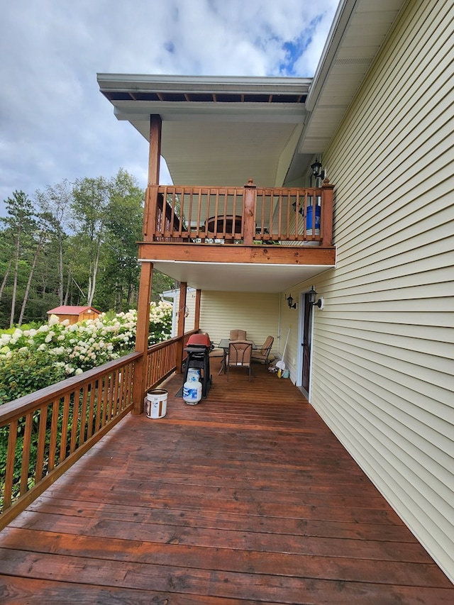 wooden deck with grilling area