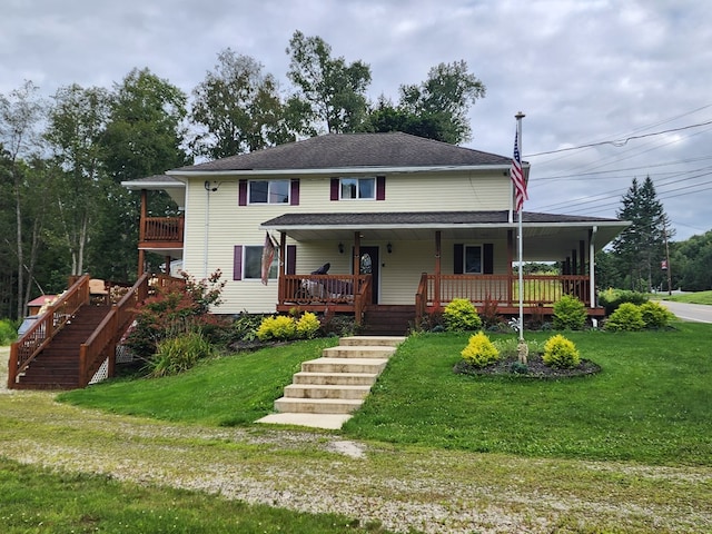 view of front of home with a porch and a front yard