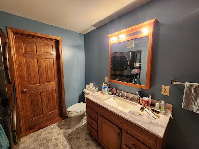 bathroom with tile patterned floors, vanity, and toilet