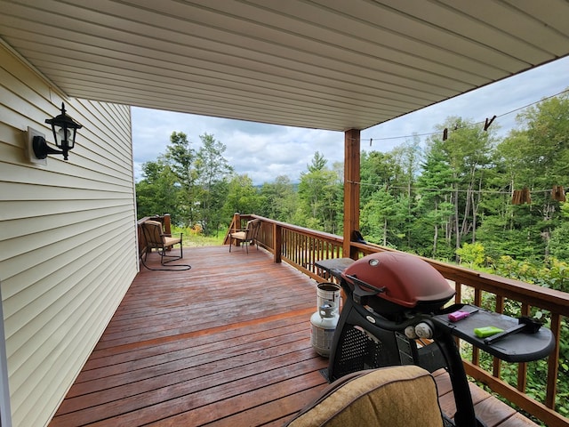 wooden deck with area for grilling