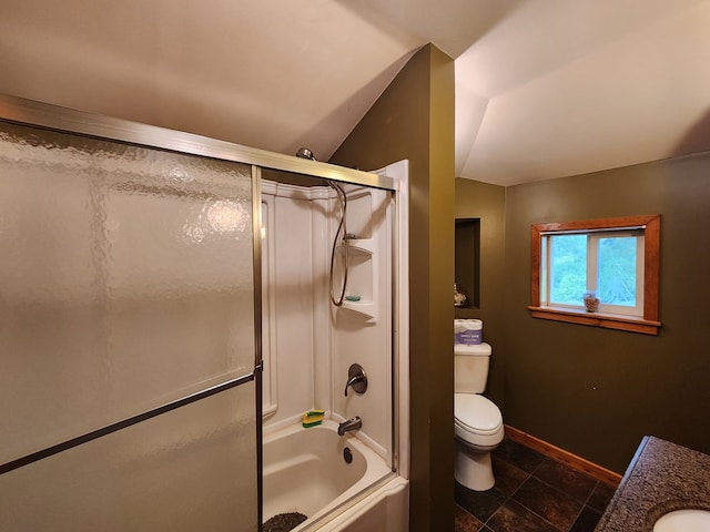 bathroom with lofted ceiling, toilet, and enclosed tub / shower combo