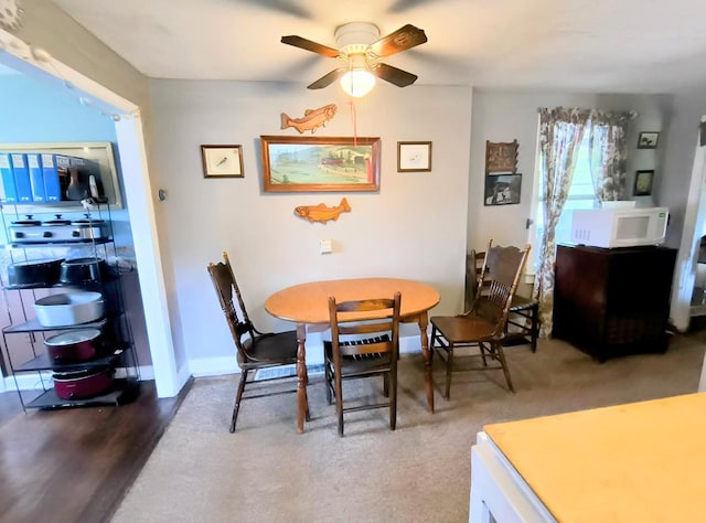 2756 Austinville Rd, Troy, PA 16947 - dining area featuring a ceiling fan, wood finished floors, and baseboards