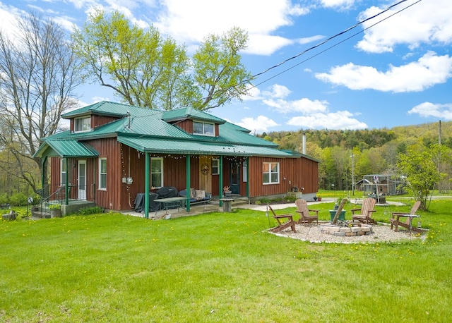 1503 Stewart Rd, Addison, NY 14801 - back of property with a fire pit, a yard, a patio area, and board and batten siding