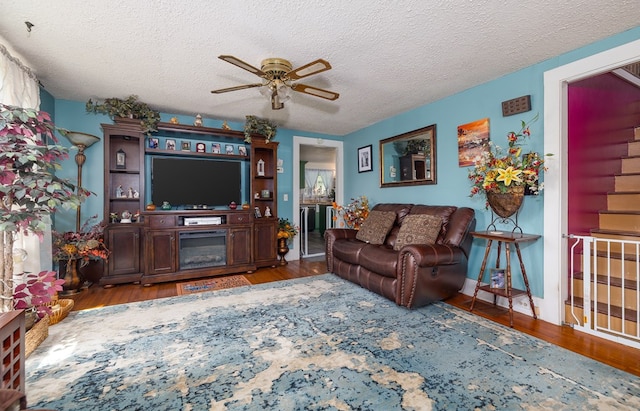 1503 Stewart Rd, Addison, NY 14801 - living area with a ceiling fan, wood finished floors, and a textured ceiling