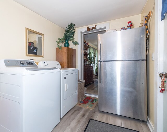 1503 Stewart Rd, Addison, NY 14801 - clothes washing area featuring light wood-type flooring and separate washer and dryer
