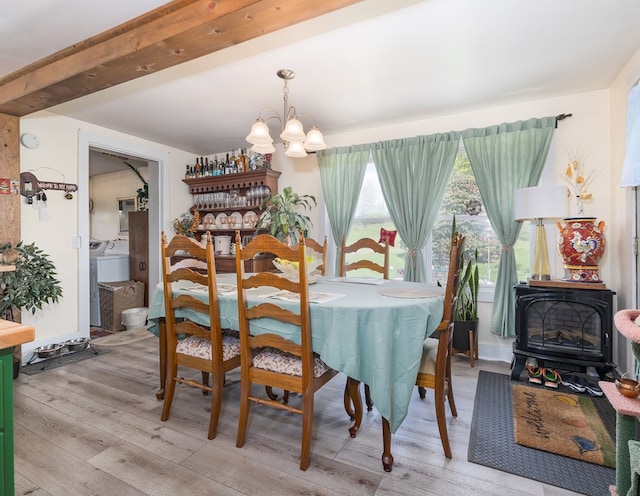 1503 Stewart Rd, Addison, NY 14801 - dining area featuring a chandelier, wood finished floors, a wood stove, and beam ceiling