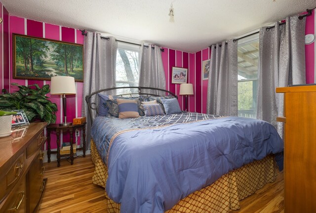 1503 Stewart Rd, Addison, NY 14801 - bedroom featuring wood finished floors and wallpapered walls