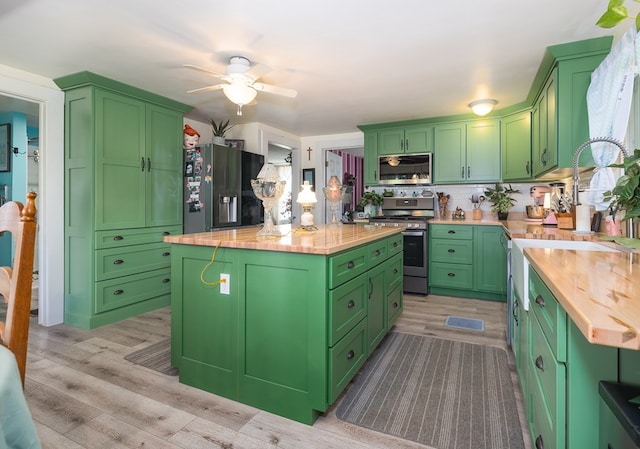1503 Stewart Rd, Addison, NY 14801 - kitchen featuring stainless steel appliances, butcher block countertops, a center island, light wood-type flooring, and ceiling fan