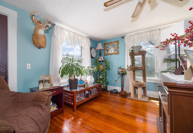 1503 Stewart Rd, Addison, NY 14801 - sitting room featuring a textured ceiling, hardwood / wood-style flooring, ceiling fan, and baseboards